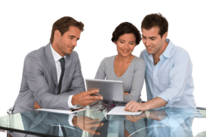 Lawyer reviewing documents with two clients