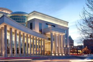 Neoclassical courthouse exterior lit at dusk