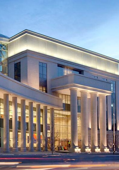 Neoclassical courthouse exterior lit at dusk